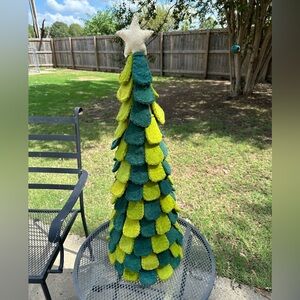 Christmas tree made of wool appliqué. Various colors of green.
